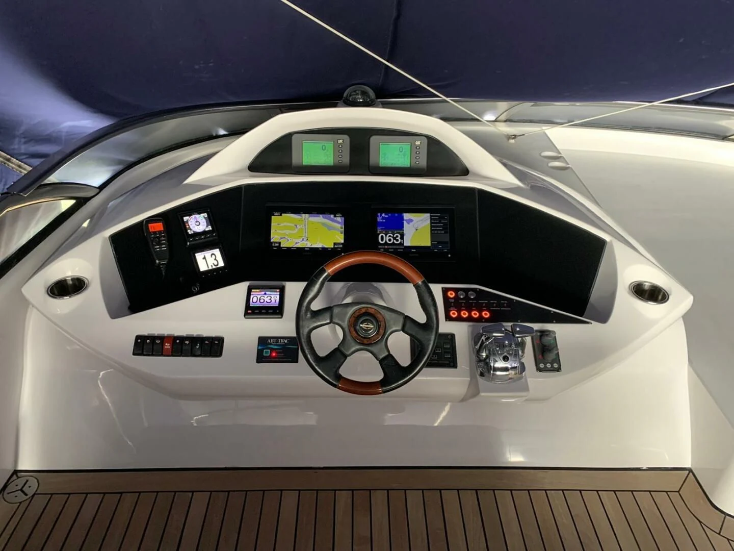 the inside of a white car aboard JULCAN II Yacht for Sale