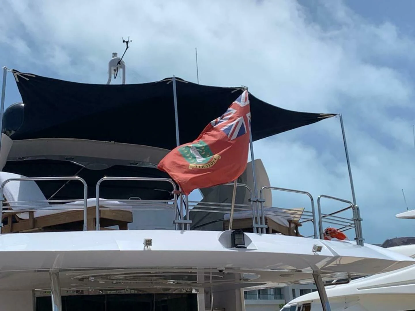 a couple of flags on a boat aboard JULCAN II Yacht for Sale