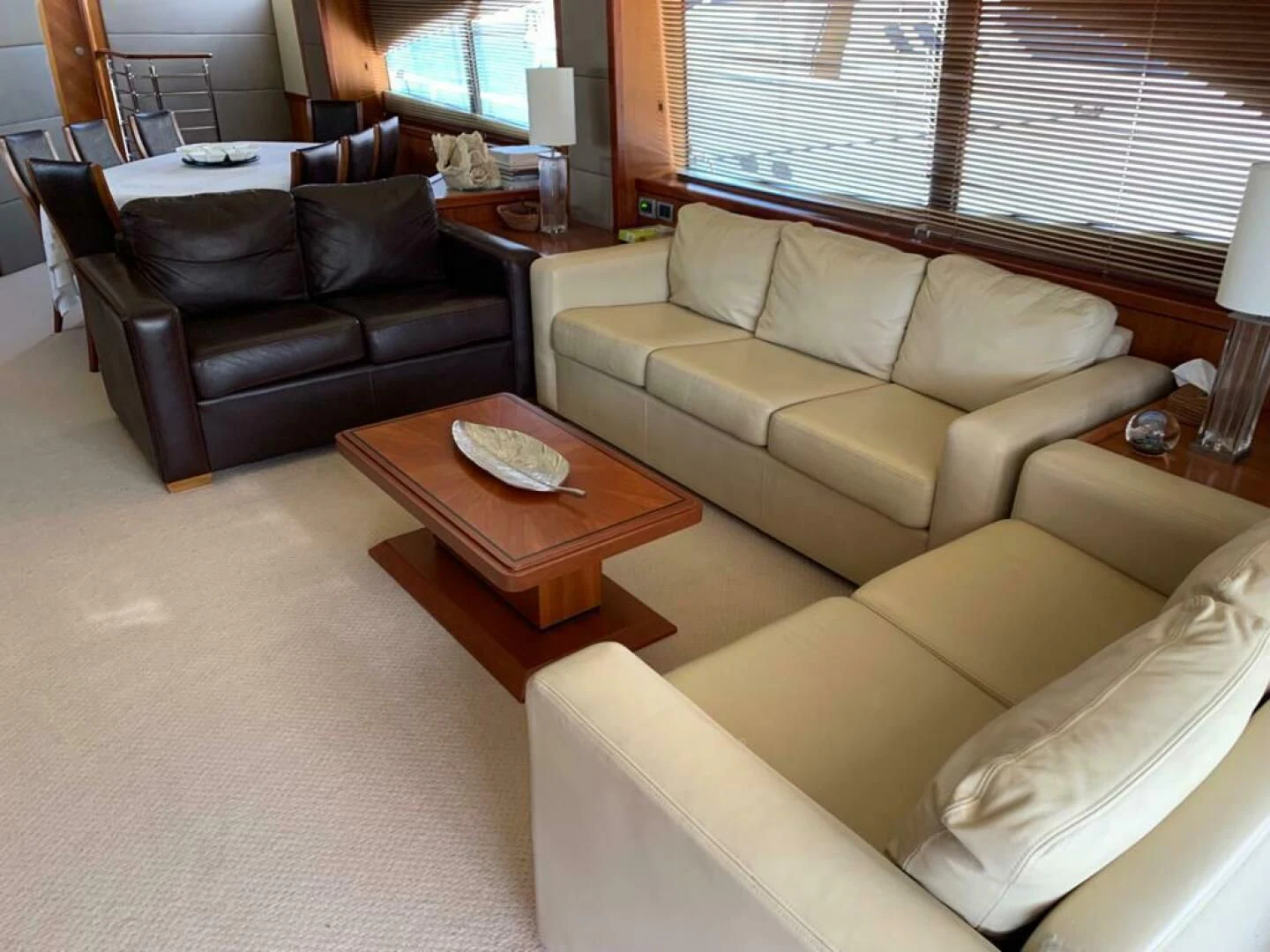 a living room with a couch and a coffee table aboard JULCAN II Yacht for Sale