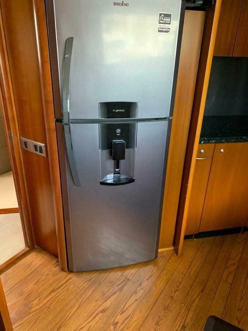 a refrigerator in a kitchen aboard JULCAN II Yacht for Sale