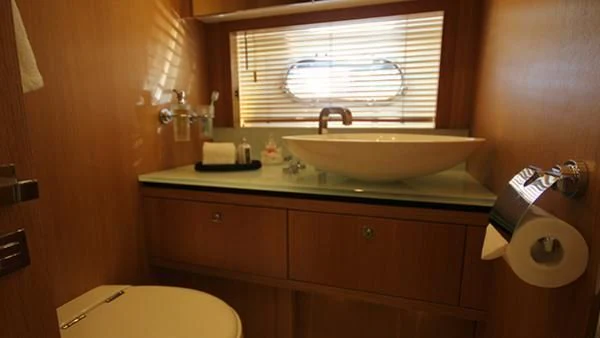 a bathroom with a sink and a window aboard BST SUNRISE Yacht for Sale