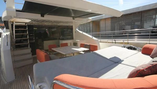 a room with a bed and a table aboard BST SUNRISE Yacht for Sale