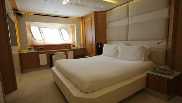 a room with a bed and a desk aboard BST SUNRISE Yacht for Sale