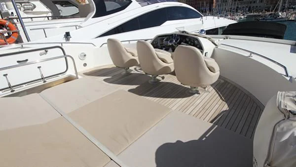 a white car parked in a parking lot aboard BST SUNRISE Yacht for Sale