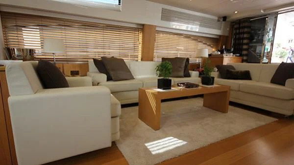 a living room with a couch and a coffee table aboard BST SUNRISE Yacht for Sale