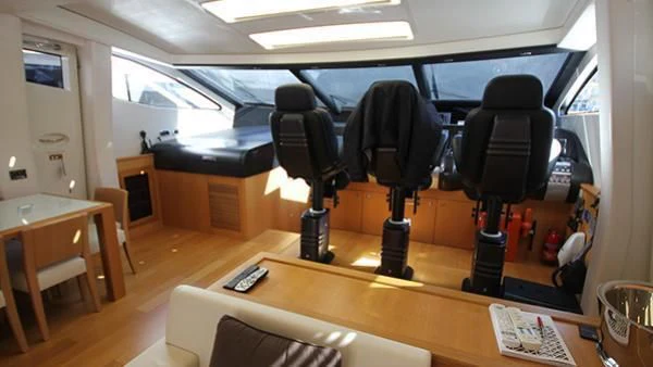 a room with a desk and chairs aboard BST SUNRISE Yacht for Sale