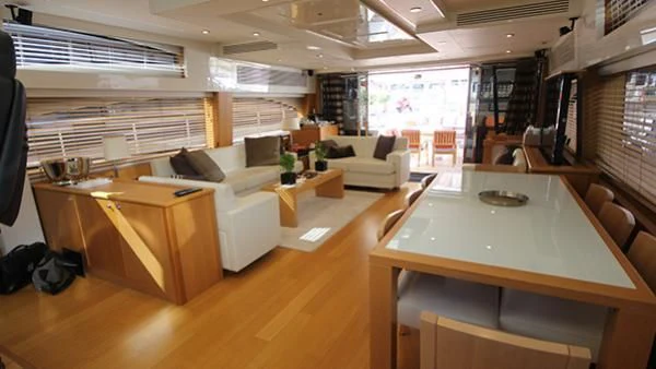 a room with a desk and a couch aboard BST SUNRISE Yacht for Sale