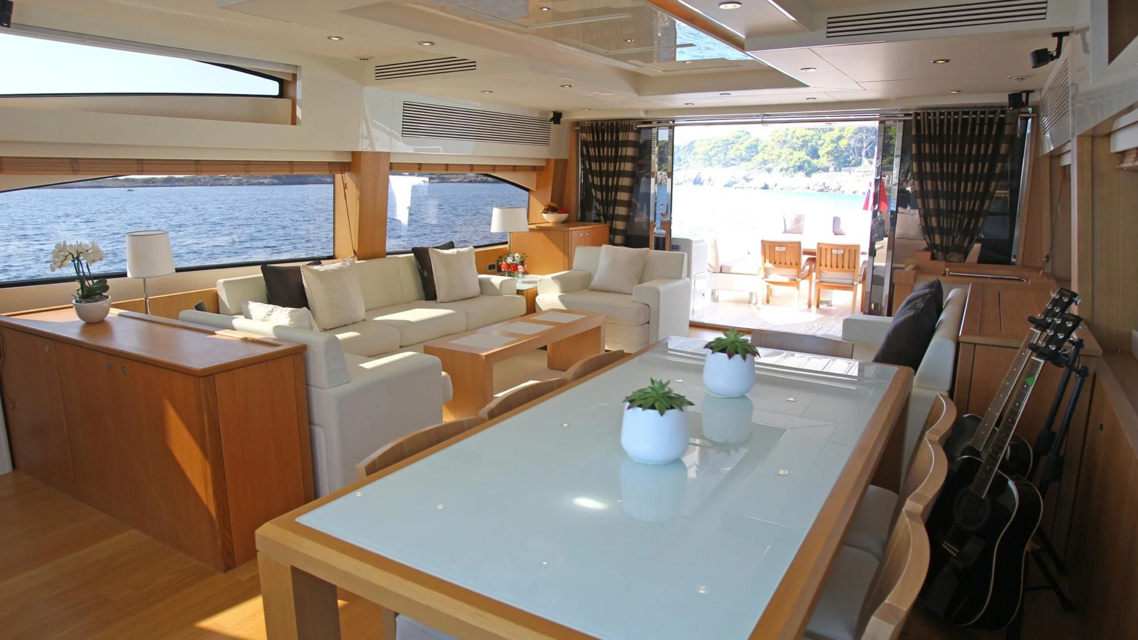 a room with a table and chairs aboard BST SUNRISE Yacht for Sale