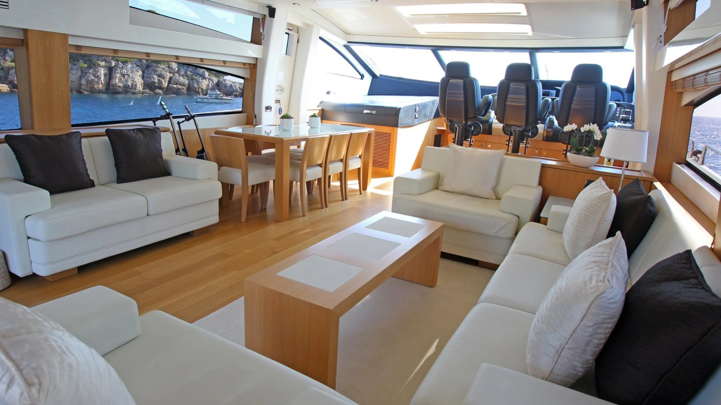 a living room with a couch and a table aboard BST SUNRISE Yacht for Sale