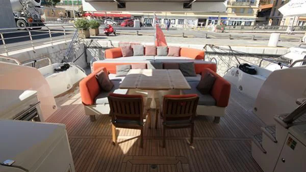 a group of chairs and tables in a room with a building aboard BST SUNRISE Yacht for Sale