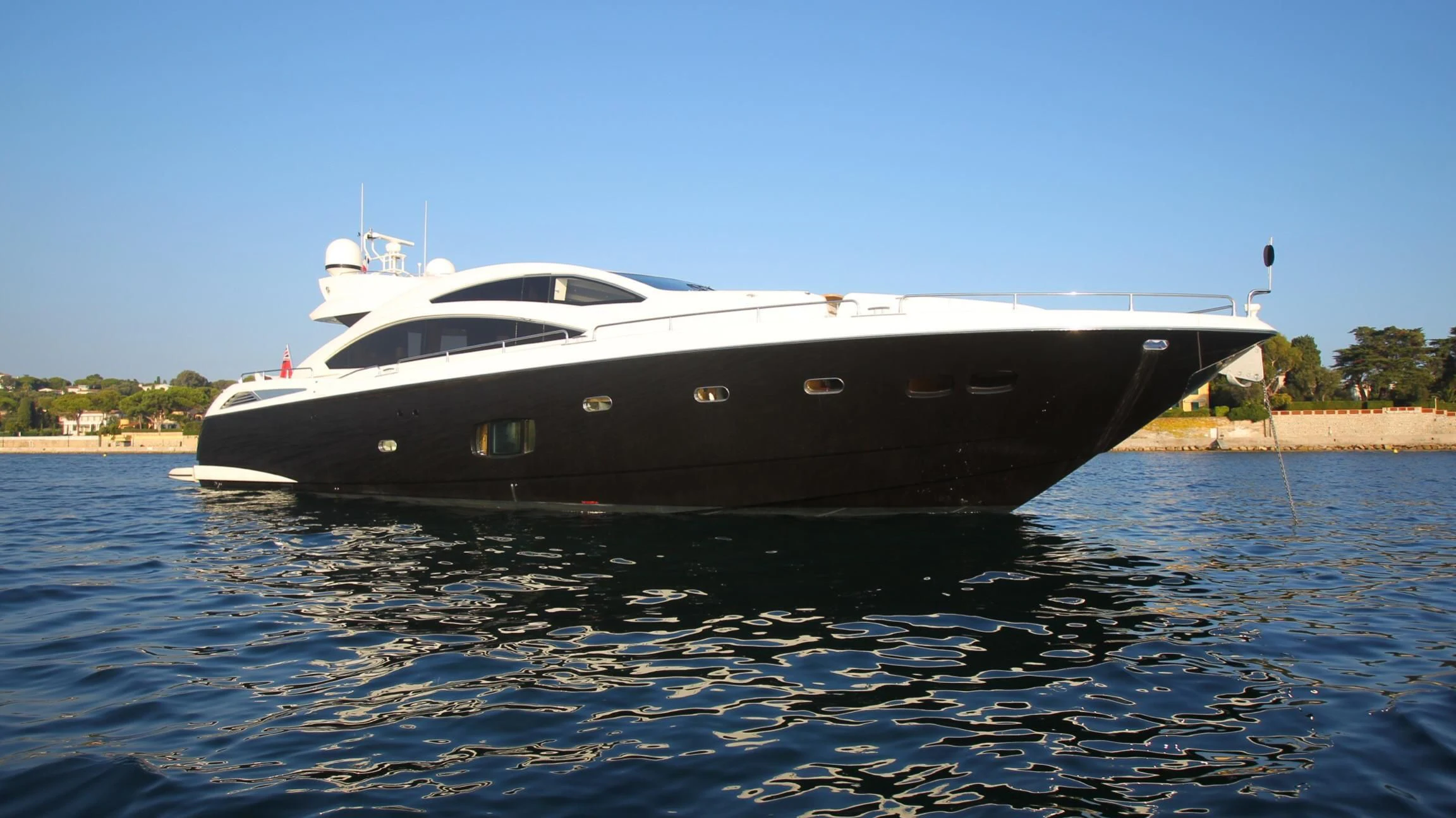 a black and white yacht on water aboard BST SUNRISE Yacht for Sale