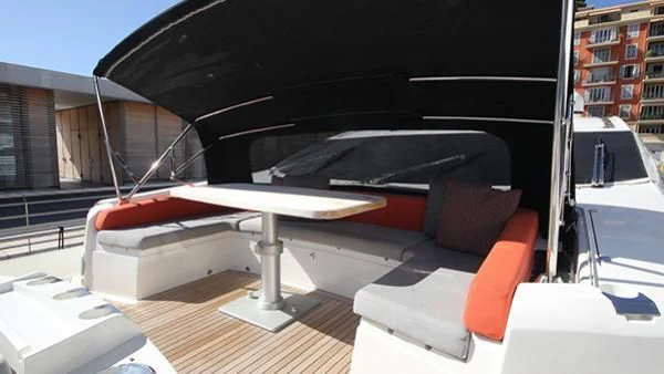a table and a chair on a boat aboard BST SUNRISE Yacht for Sale