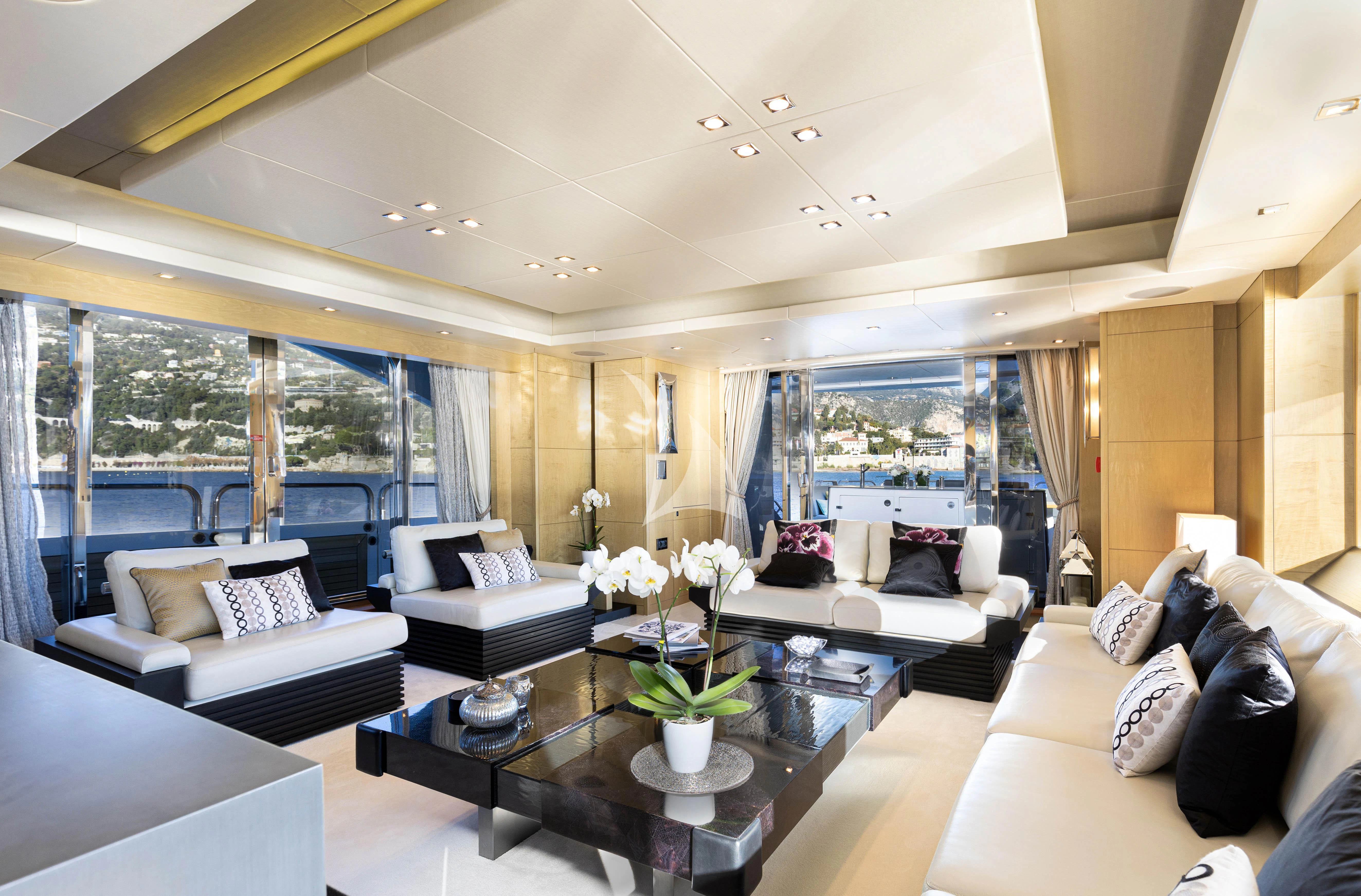 a living room with a large window aboard OKSANCHIK Yacht for Charter