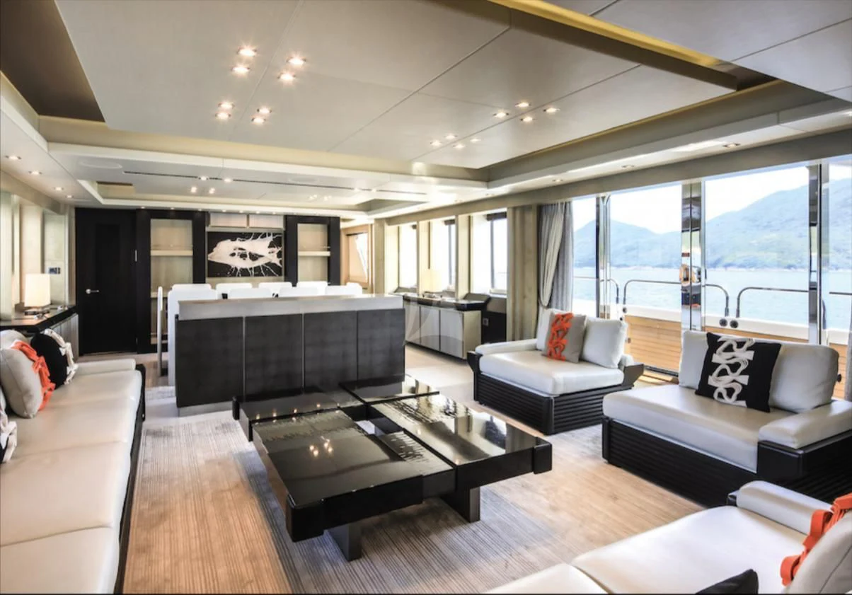 a living room with a large window aboard OKSANCHIK Yacht for Charter
