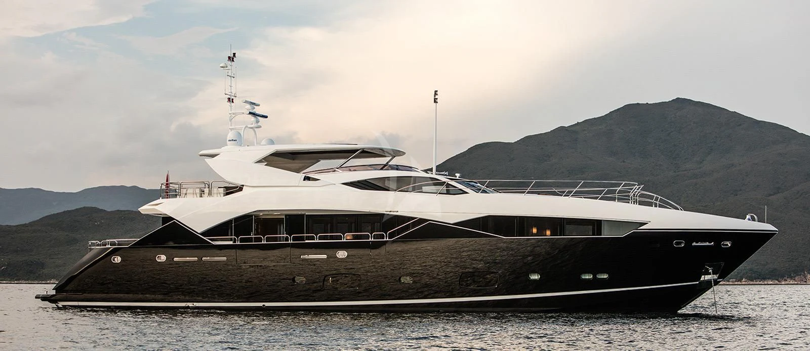a large ship in the water aboard OKSANCHIK Yacht for Charter