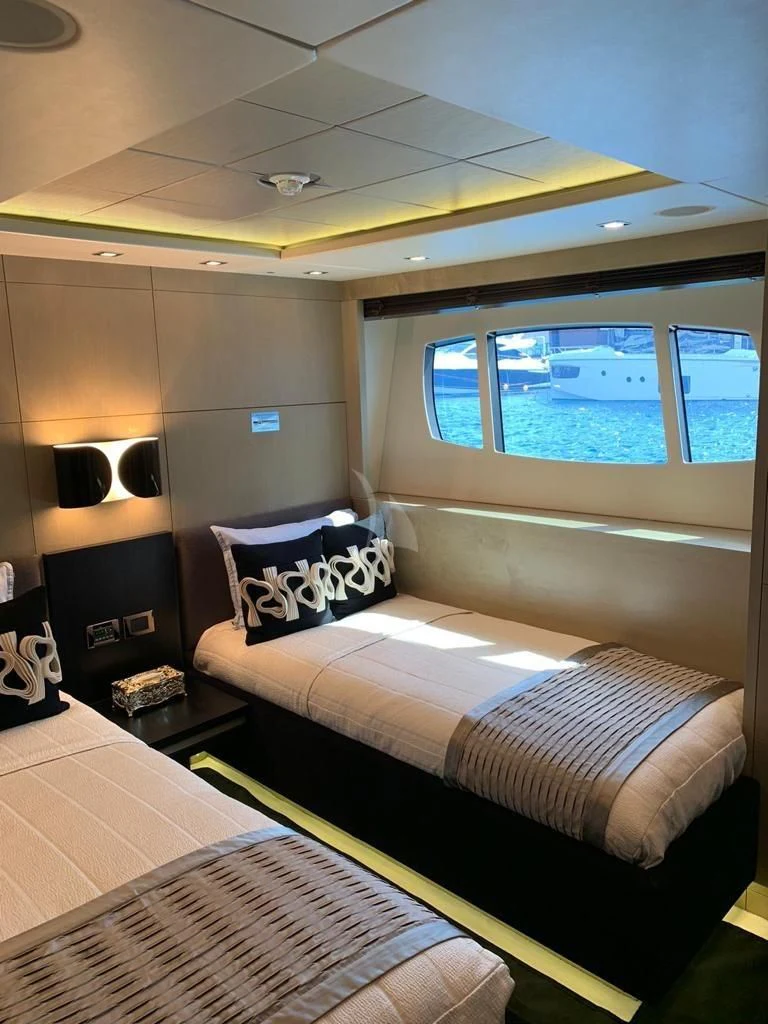 a room with two beds aboard OKSANCHIK Yacht for Charter