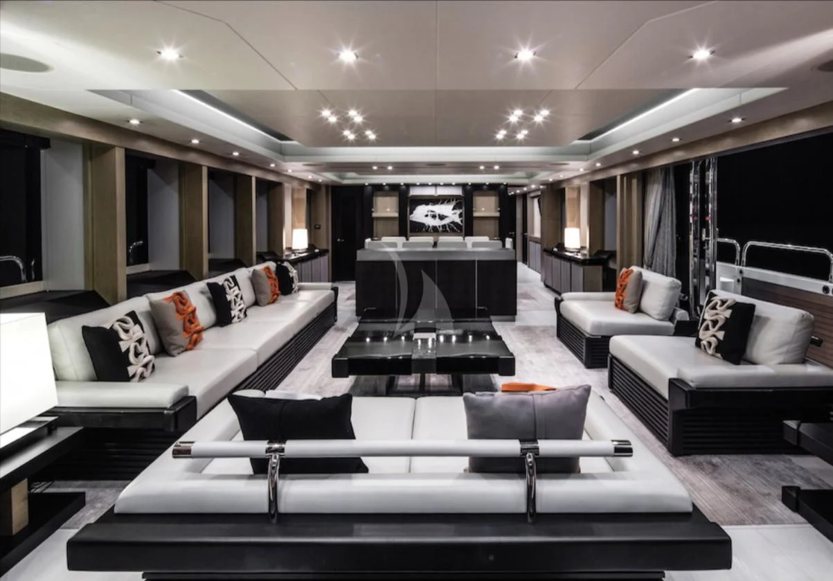 a living room with a large table aboard OKSANCHIK Yacht for Charter