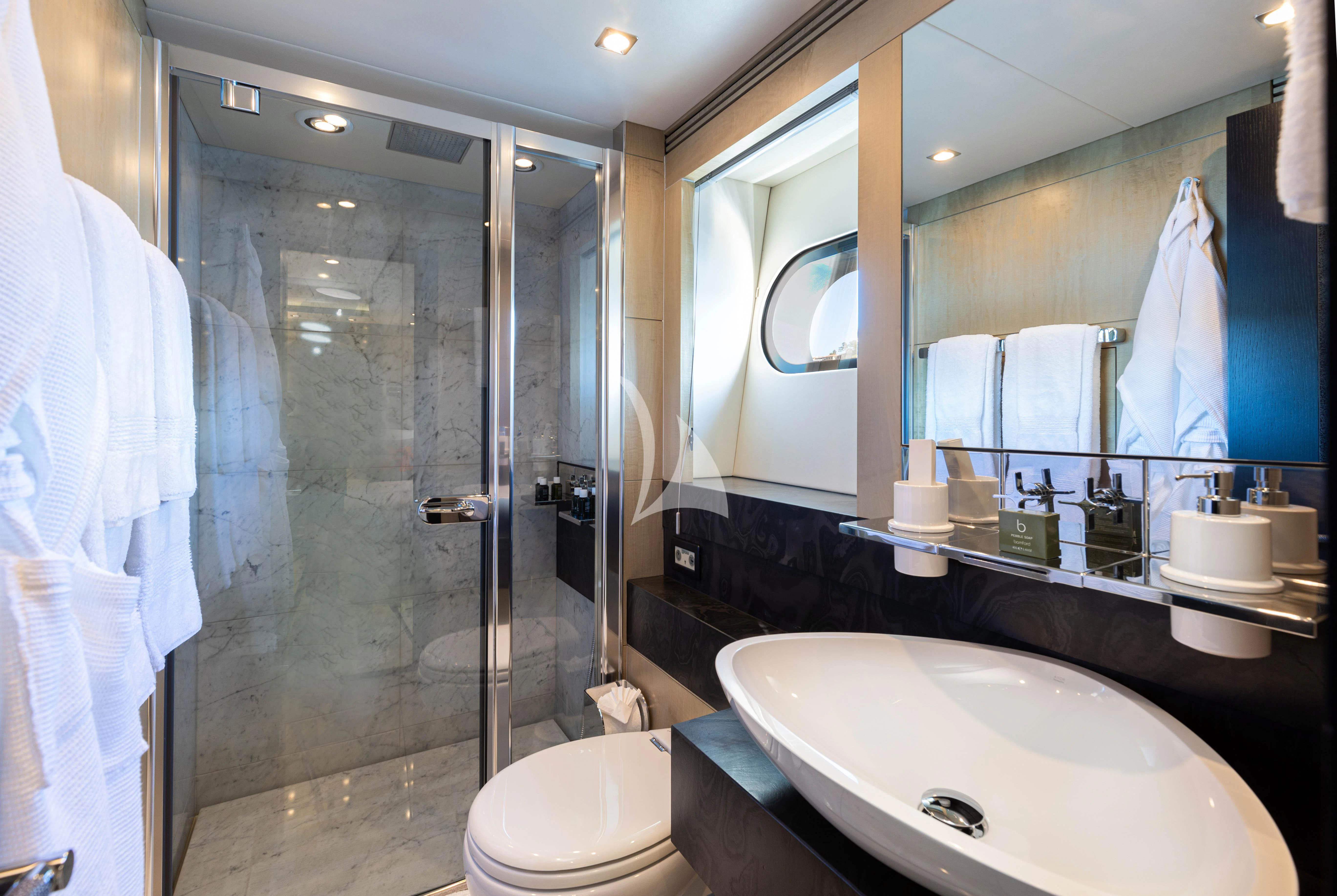 a bathroom with a glass shower aboard OKSANCHIK Yacht for Charter