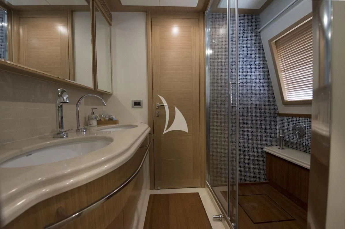 a bathroom with a sink and a shower aboard DANA Yacht for Sale
