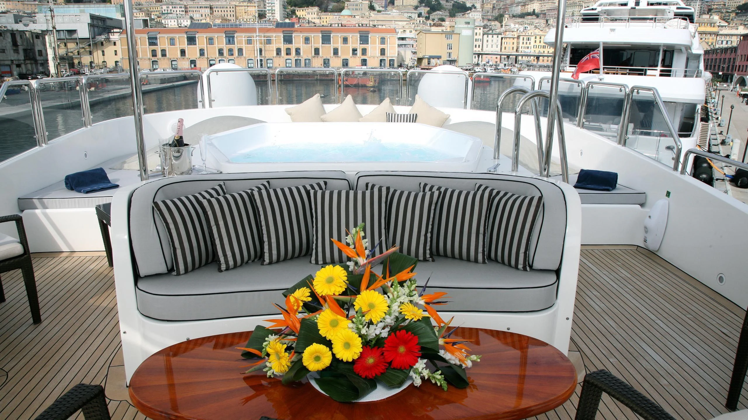 a table with flowers on it aboard SATINE Yacht for Sale
