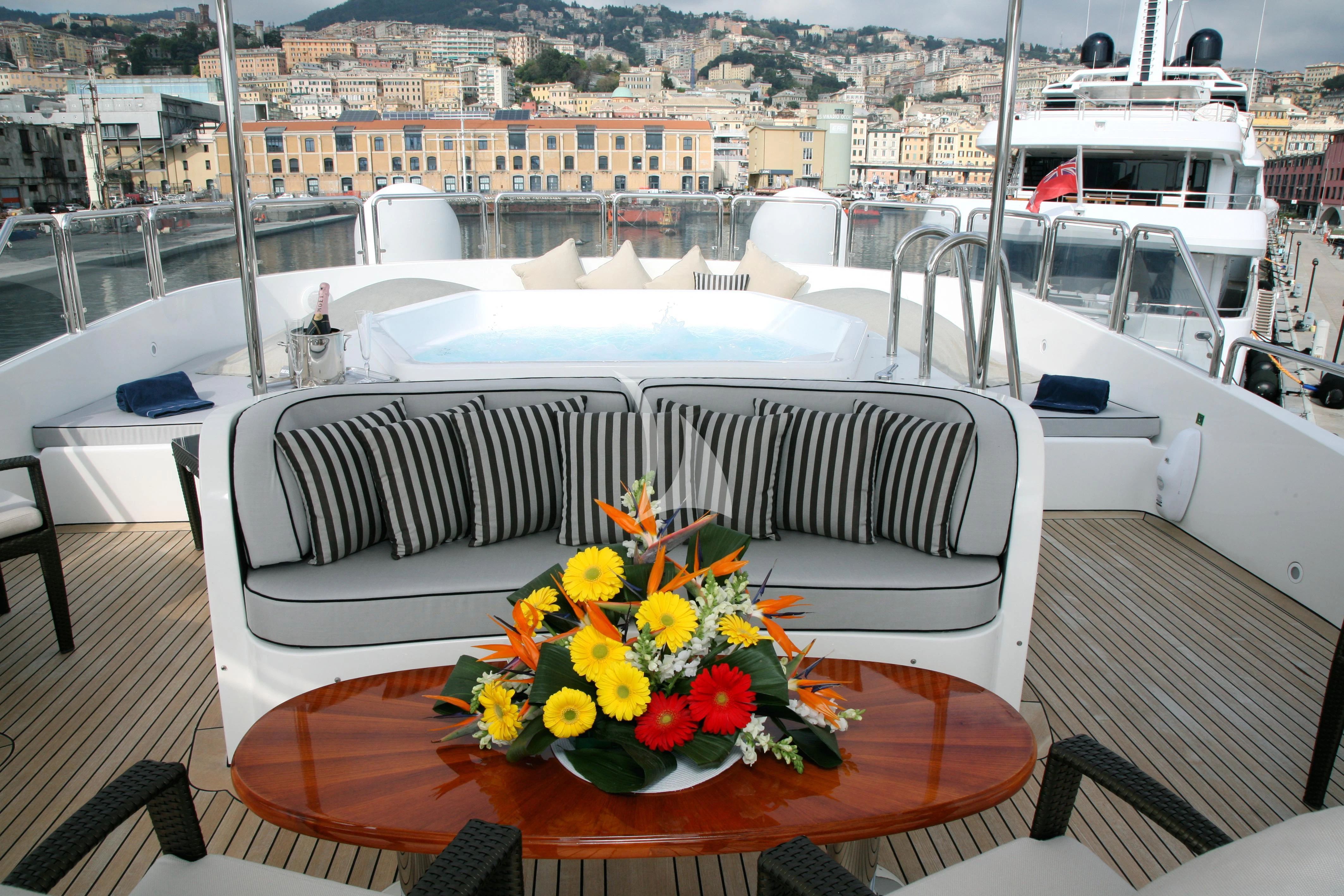 a table with flowers on it aboard SATINE Yacht for Sale