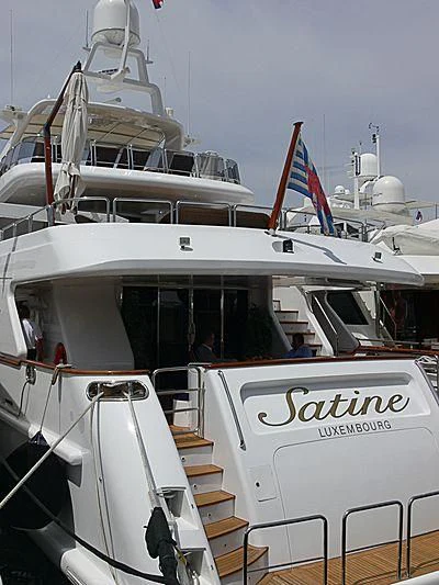 a boat with a flag on the front aboard SATINE Yacht for Sale