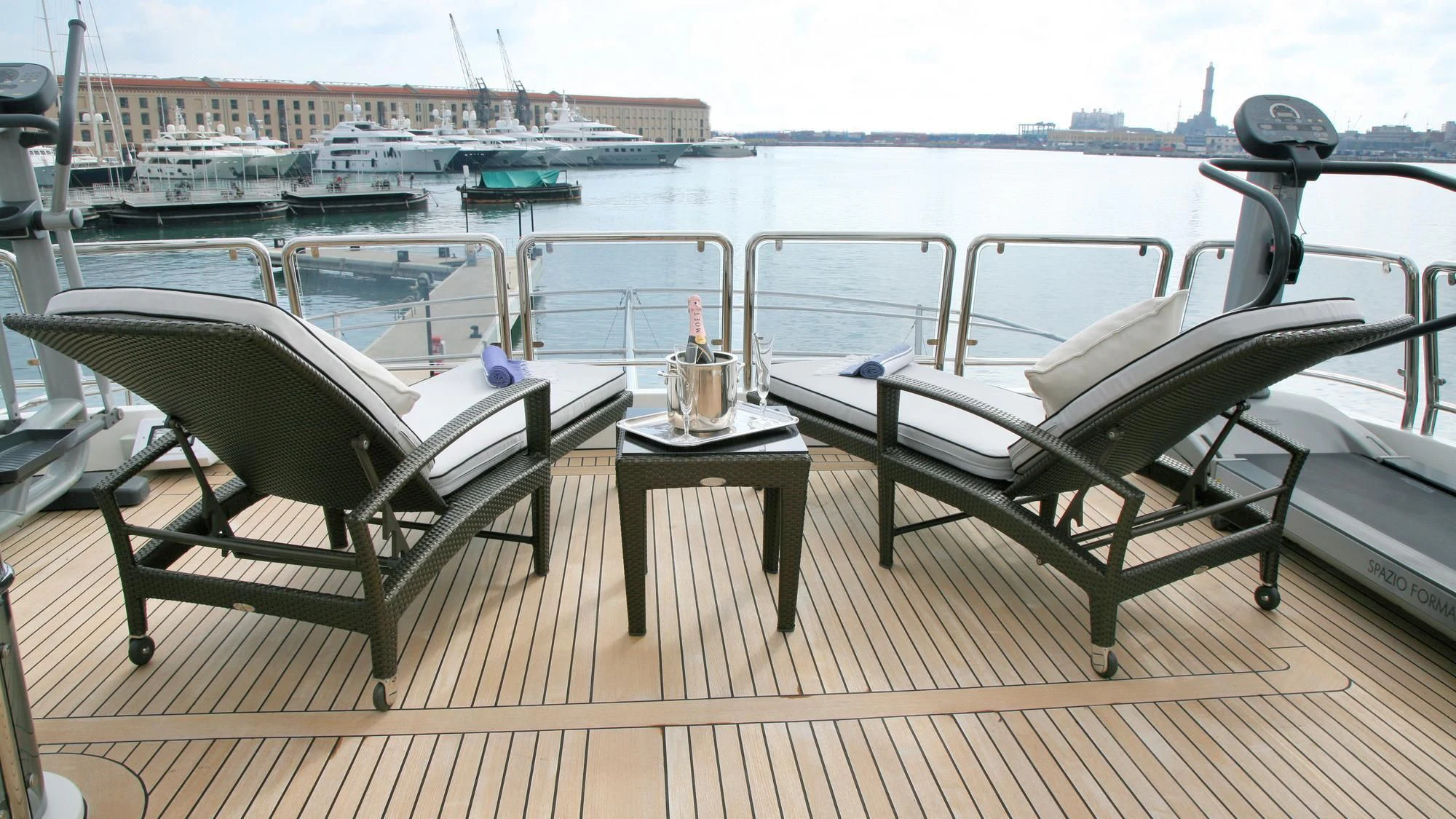 a table and chairs on a deck aboard SATINE Yacht for Sale