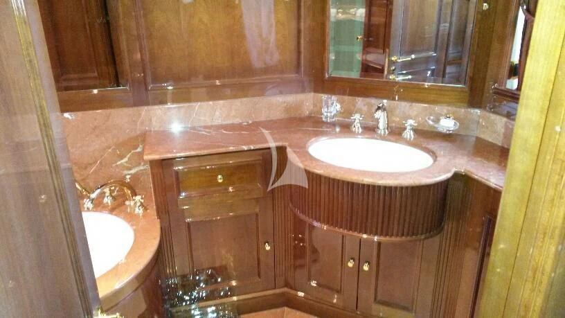 a bathroom with a sink and a mirror aboard SATINE Yacht for Sale