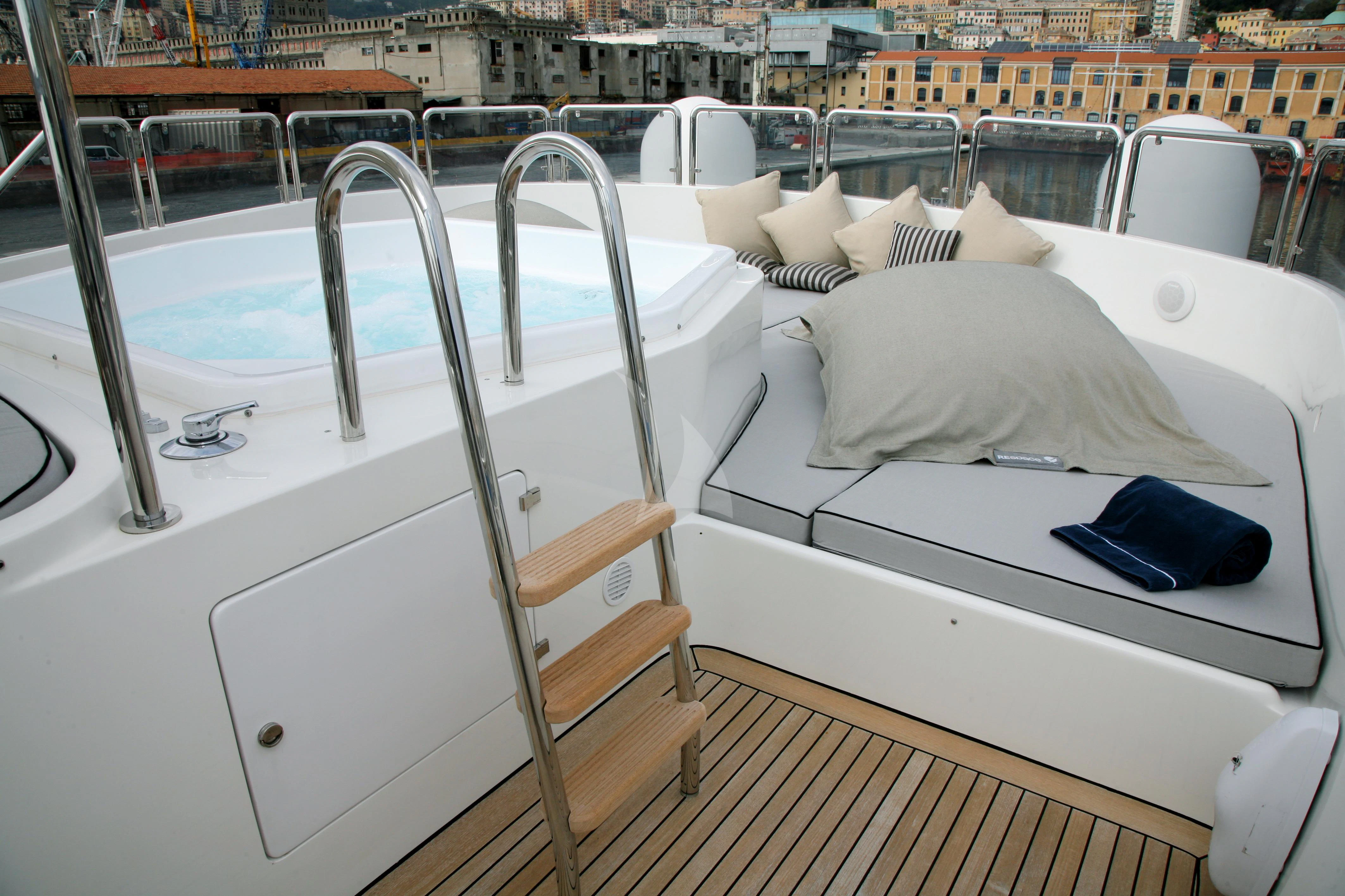 a boat with a seat and a pillow on the deck aboard SATINE Yacht for Sale