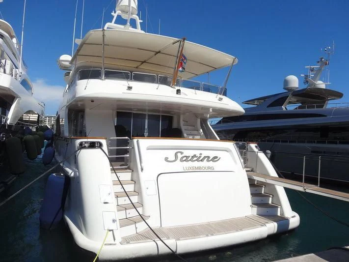 a boat docked at a pier aboard SATINE Yacht for Sale