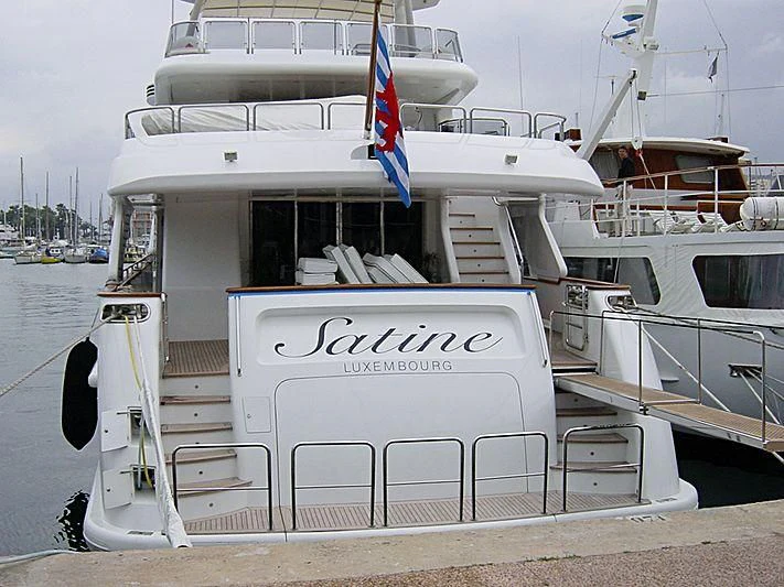 a boat docked at a pier aboard SATINE Yacht for Sale