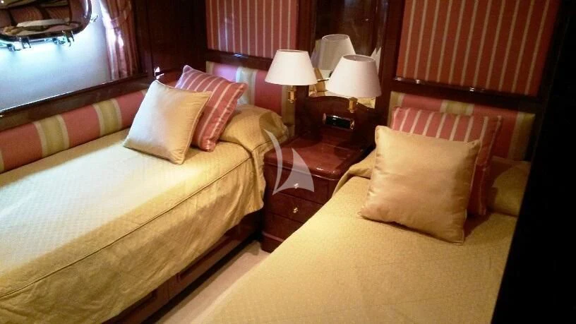 a couple of beds in a hotel room aboard SATINE Yacht for Sale