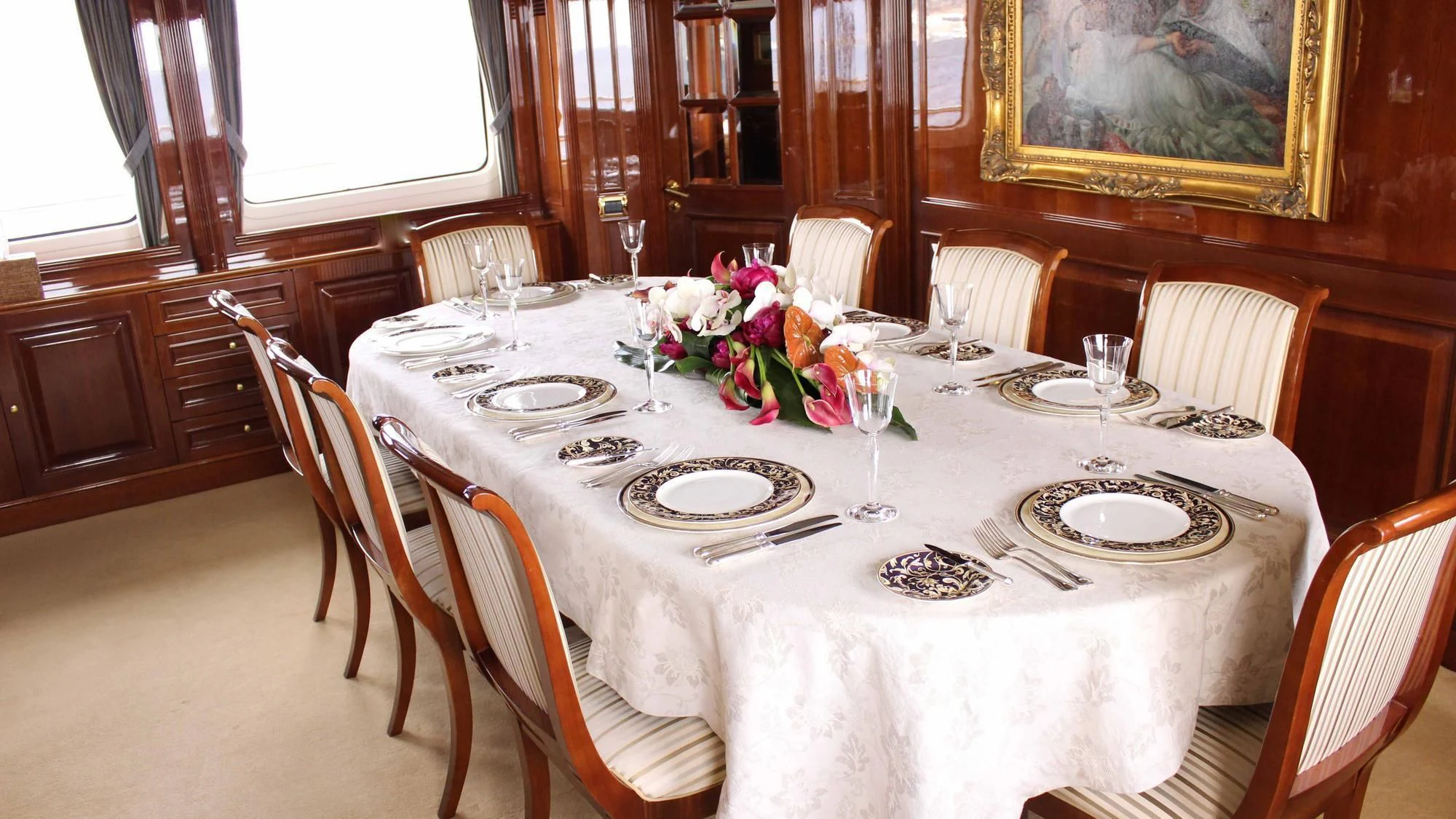 a table set for a dinner aboard SATINE Yacht for Sale