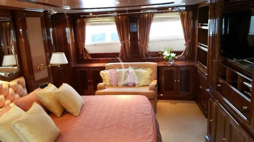 a living room with a couch and a tv aboard SATINE Yacht for Sale