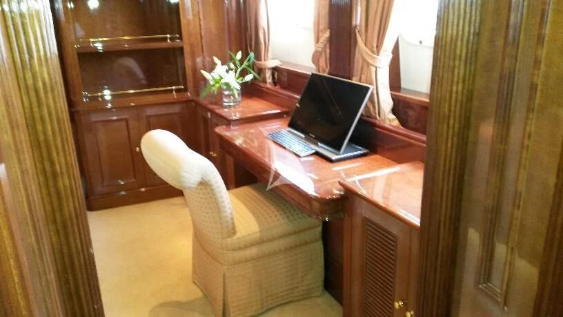 a laptop on a table aboard SATINE Yacht for Sale