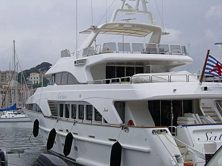 a boat with a flag on the front aboard SATINE Yacht for Sale