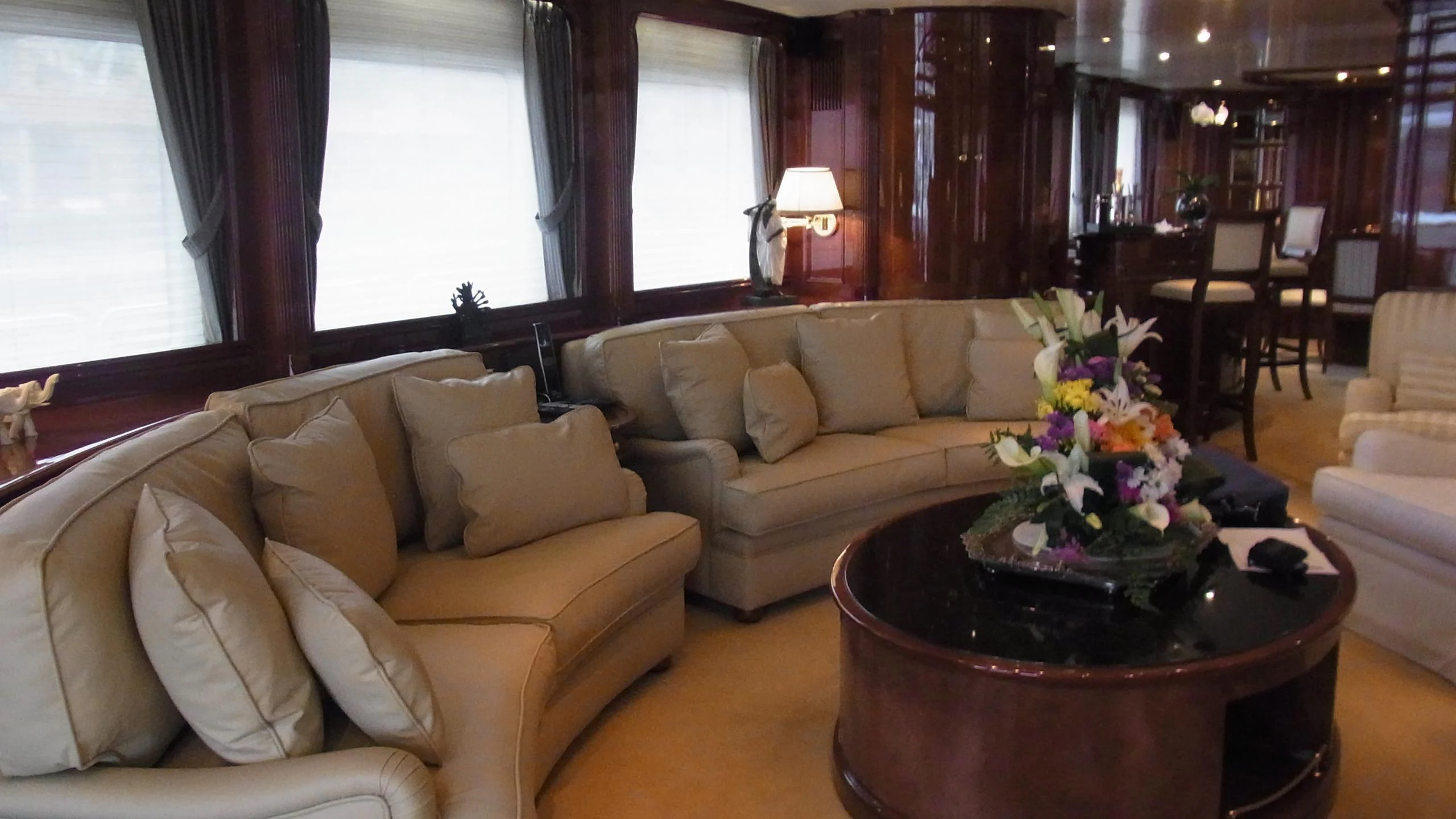 a living room with a table and couches aboard SATINE Yacht for Sale