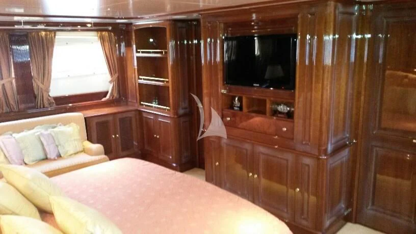 a room with a bed and a tv aboard SATINE Yacht for Sale