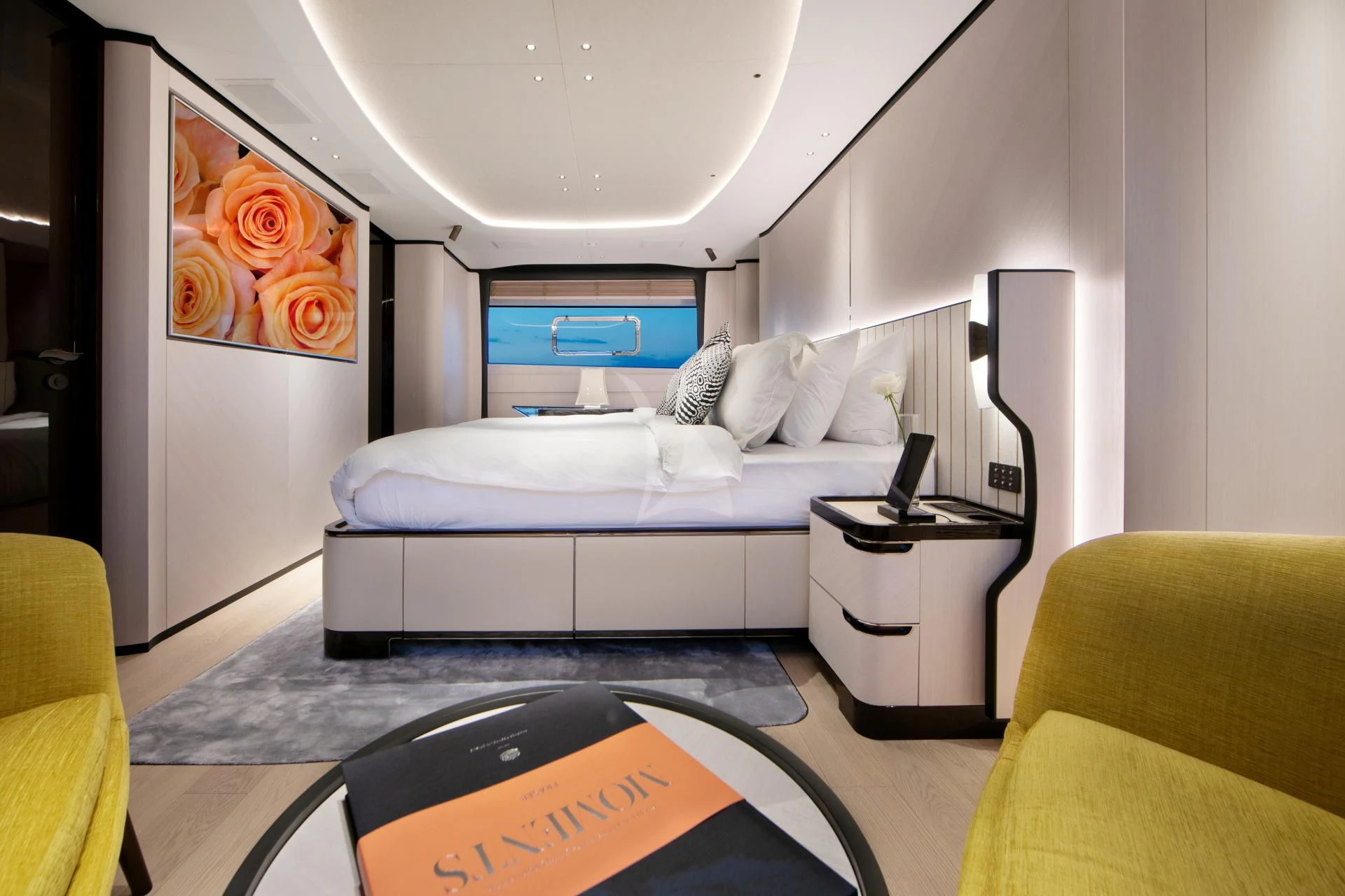 a bedroom with a bed and a desk aboard NAZ Yacht for Sale