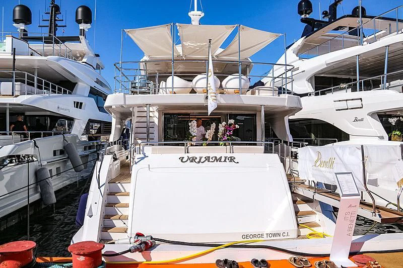 a boat docked at a pier aboard NAZ Yacht for Sale