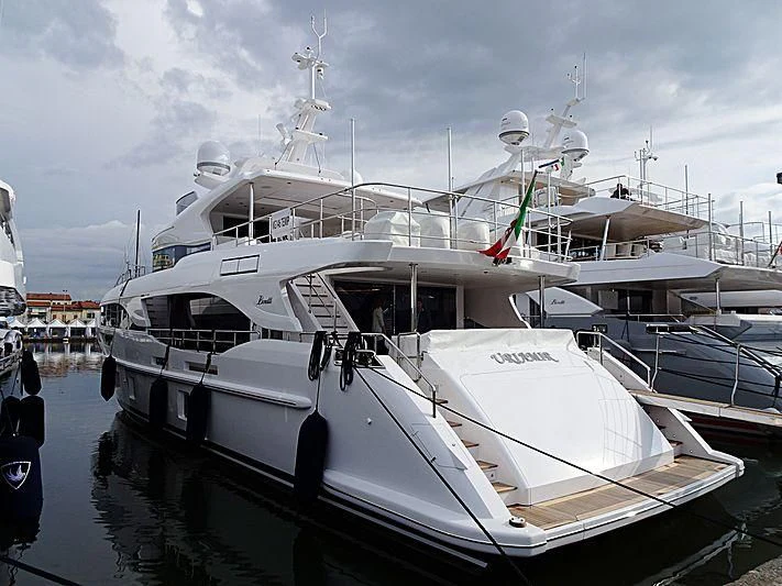 a boat docked at a pier aboard NAZ Yacht for Sale