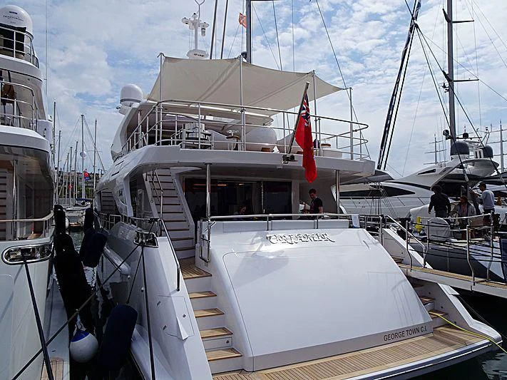 a boat with a flag on the front aboard NAZ Yacht for Sale