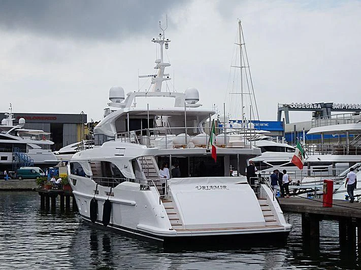 a boat docked at a pier aboard NAZ Yacht for Sale
