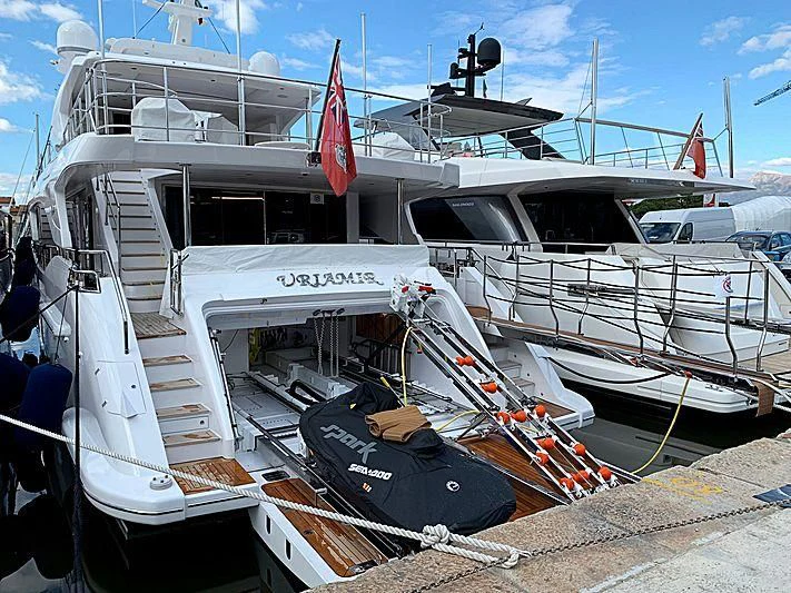 a boat with a flag on the front aboard NAZ Yacht for Sale