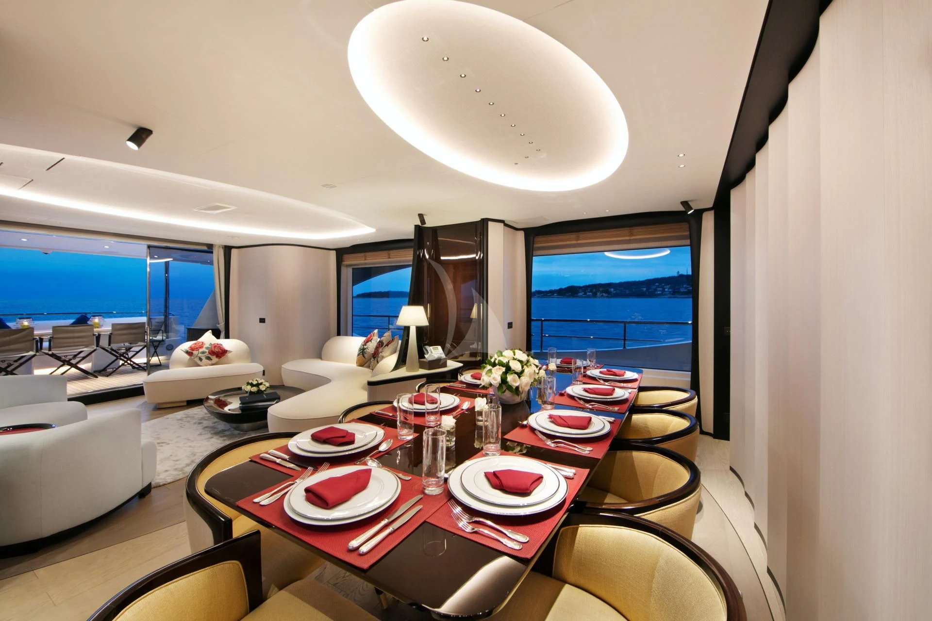 a dining room with a table and chairs aboard NAZ Yacht for Sale