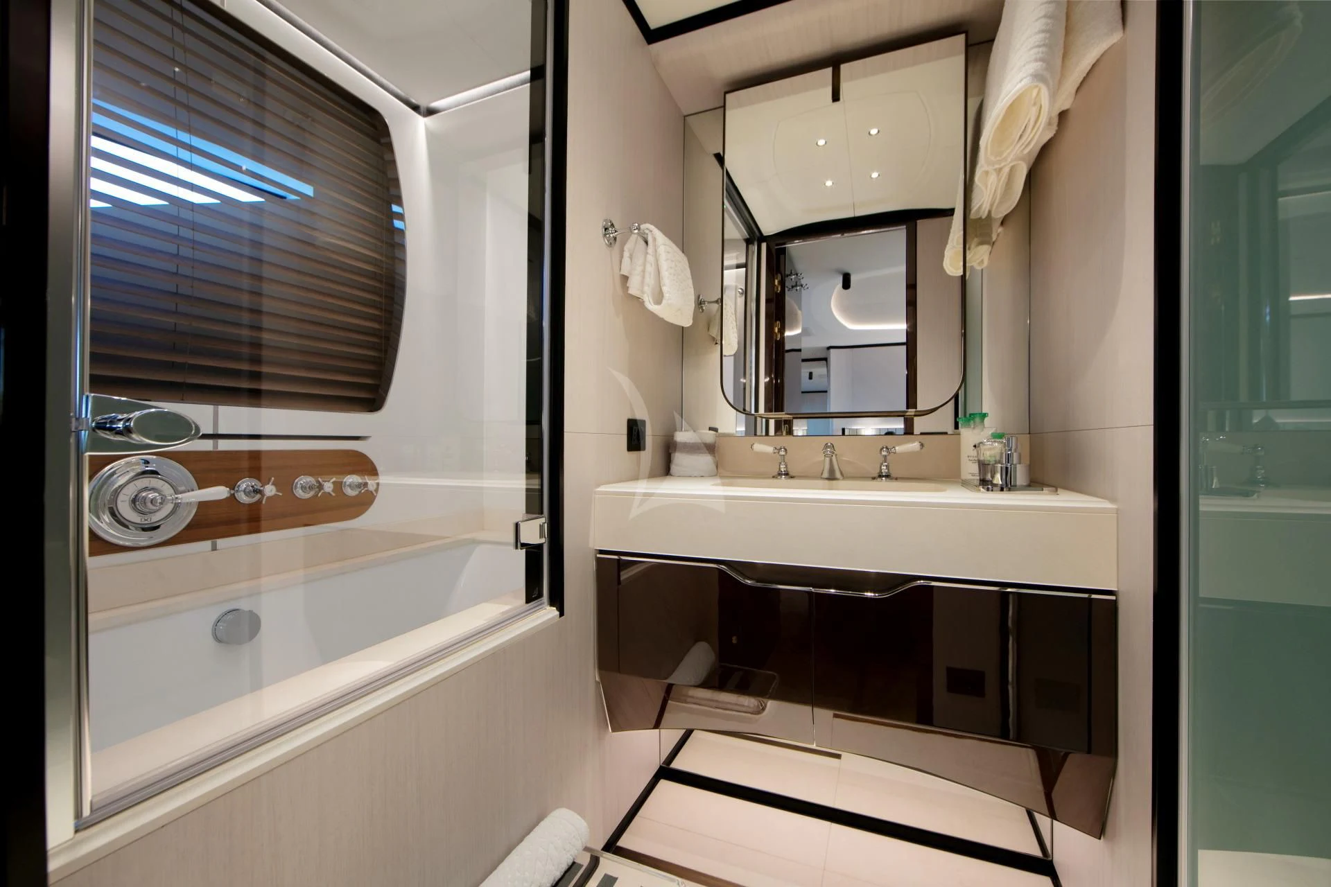 a bathroom with a sink and a mirror aboard NAZ Yacht for Sale
