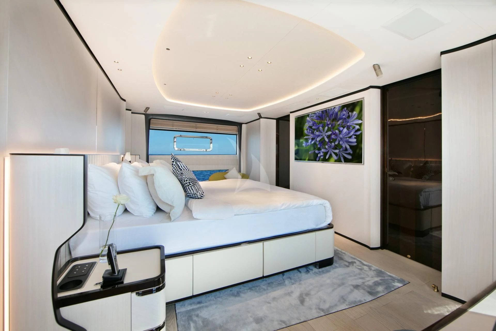 a bed with a white sheet aboard NAZ Yacht for Sale