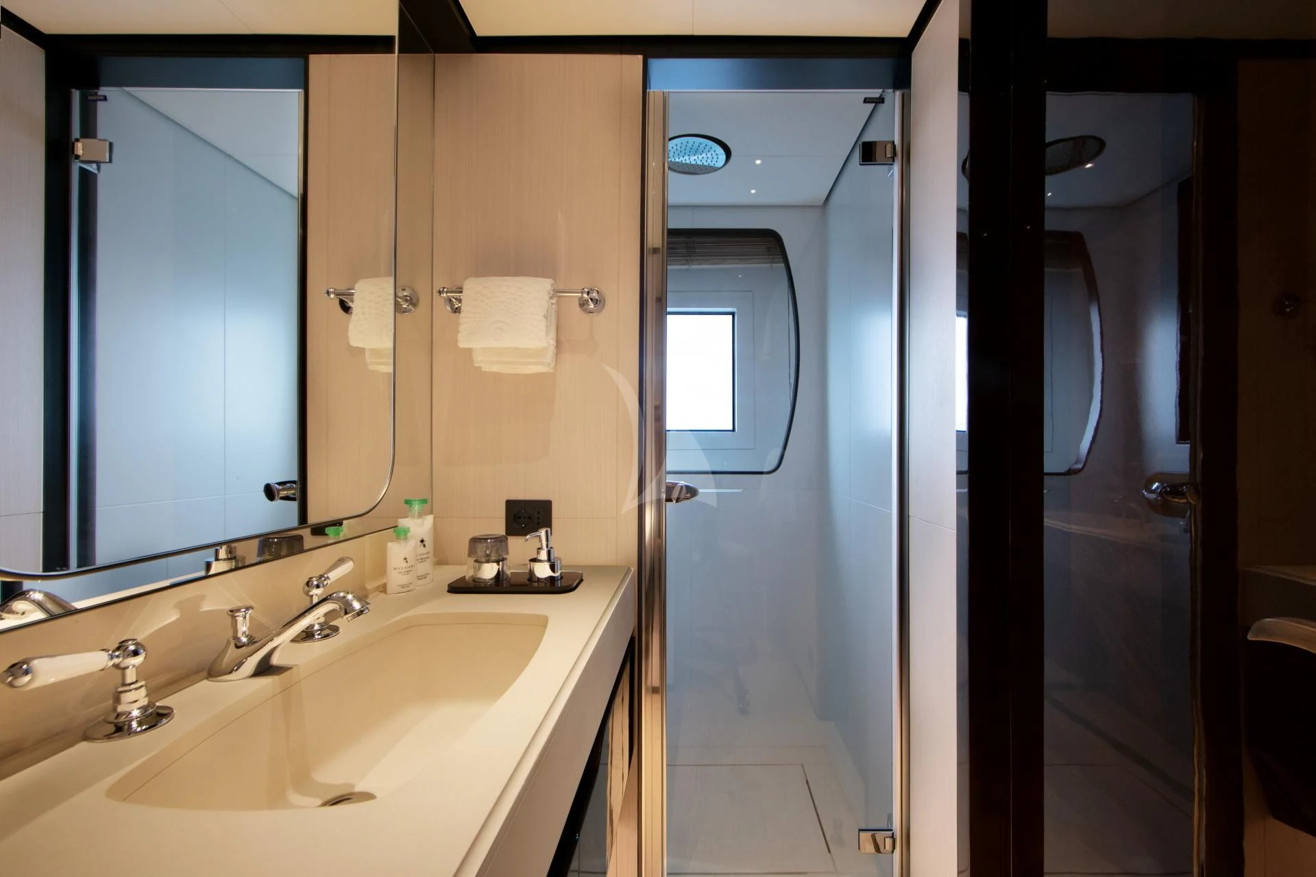 a bathroom with a sink and a mirror aboard NAZ Yacht for Sale