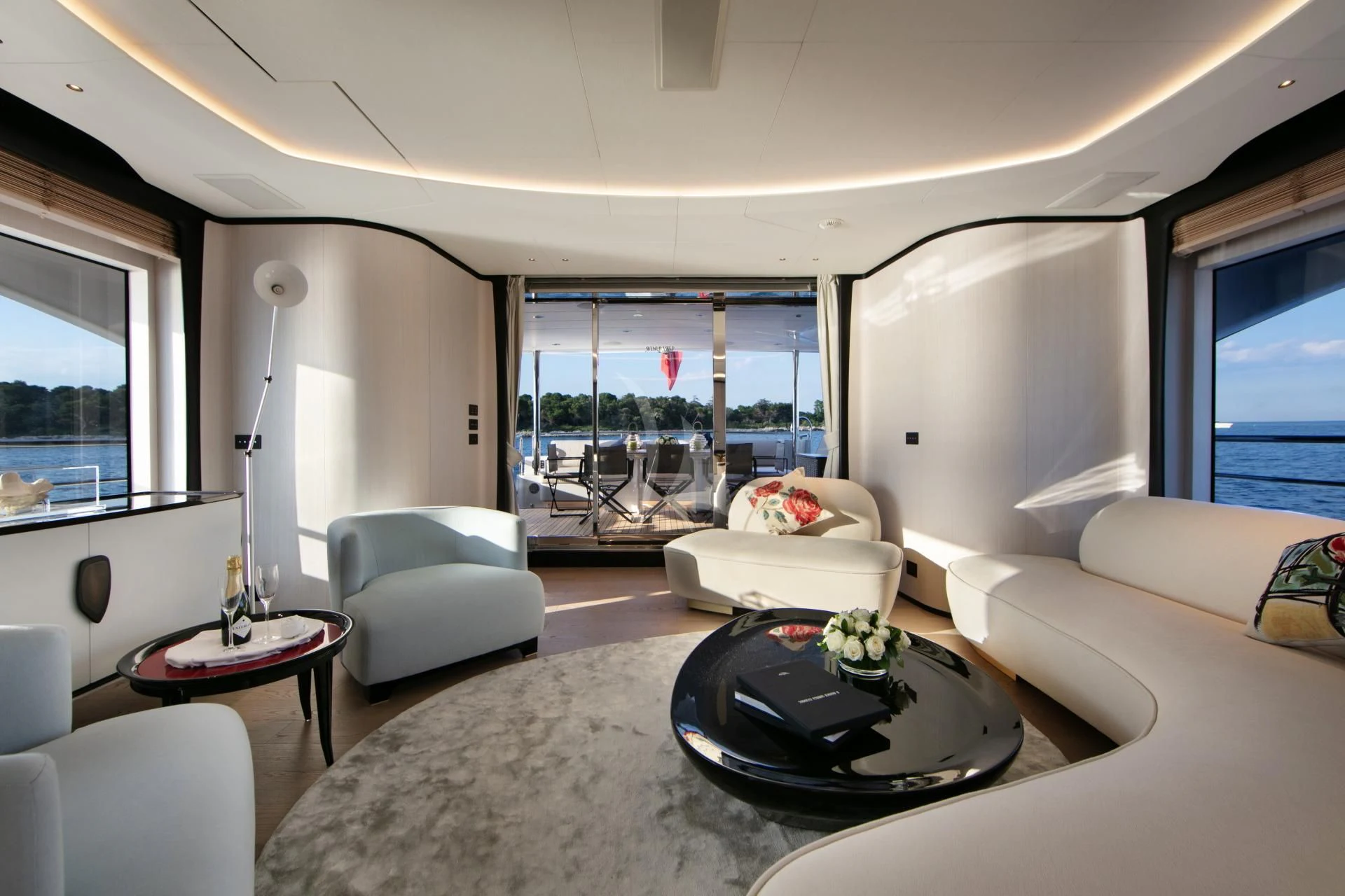 a living room with a large window aboard NAZ Yacht for Sale