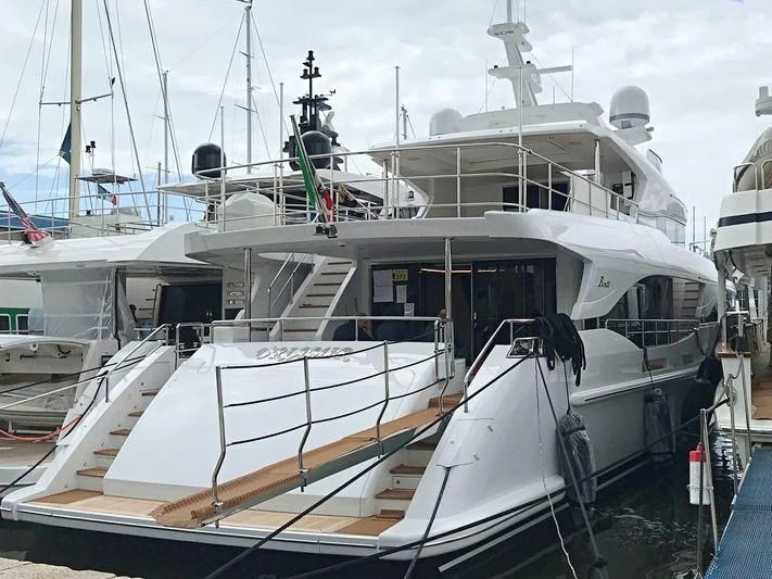 a boat docked at a pier aboard NAZ Yacht for Sale